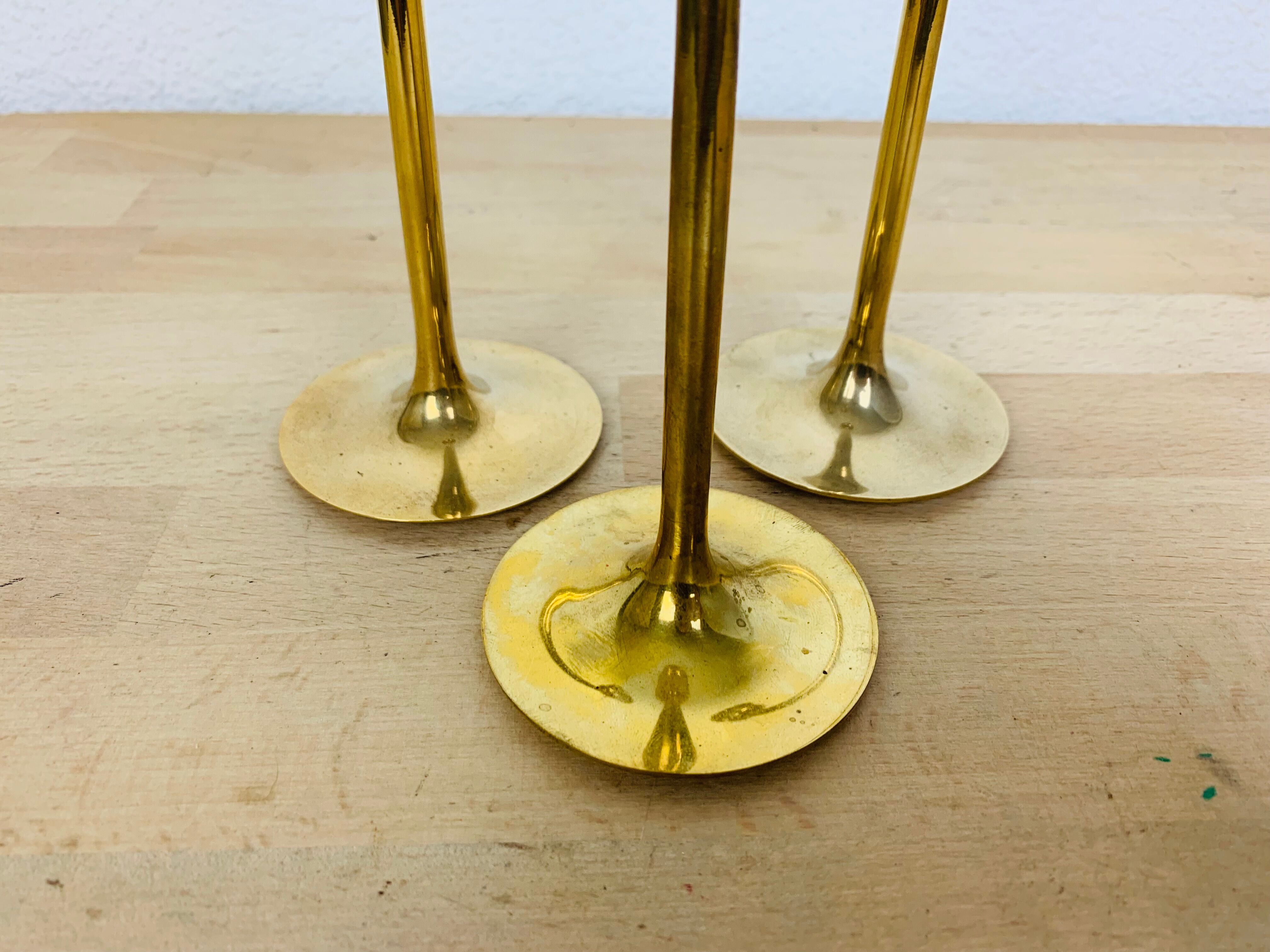 Three Scandinavian brass candle holders