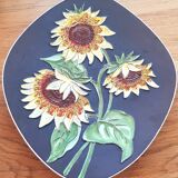 Decorative wall plate with sunflowers.