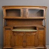 According to Gauthier-Poinsignon: large two-body buffet from the Art Nouveau period in walnut and burl.