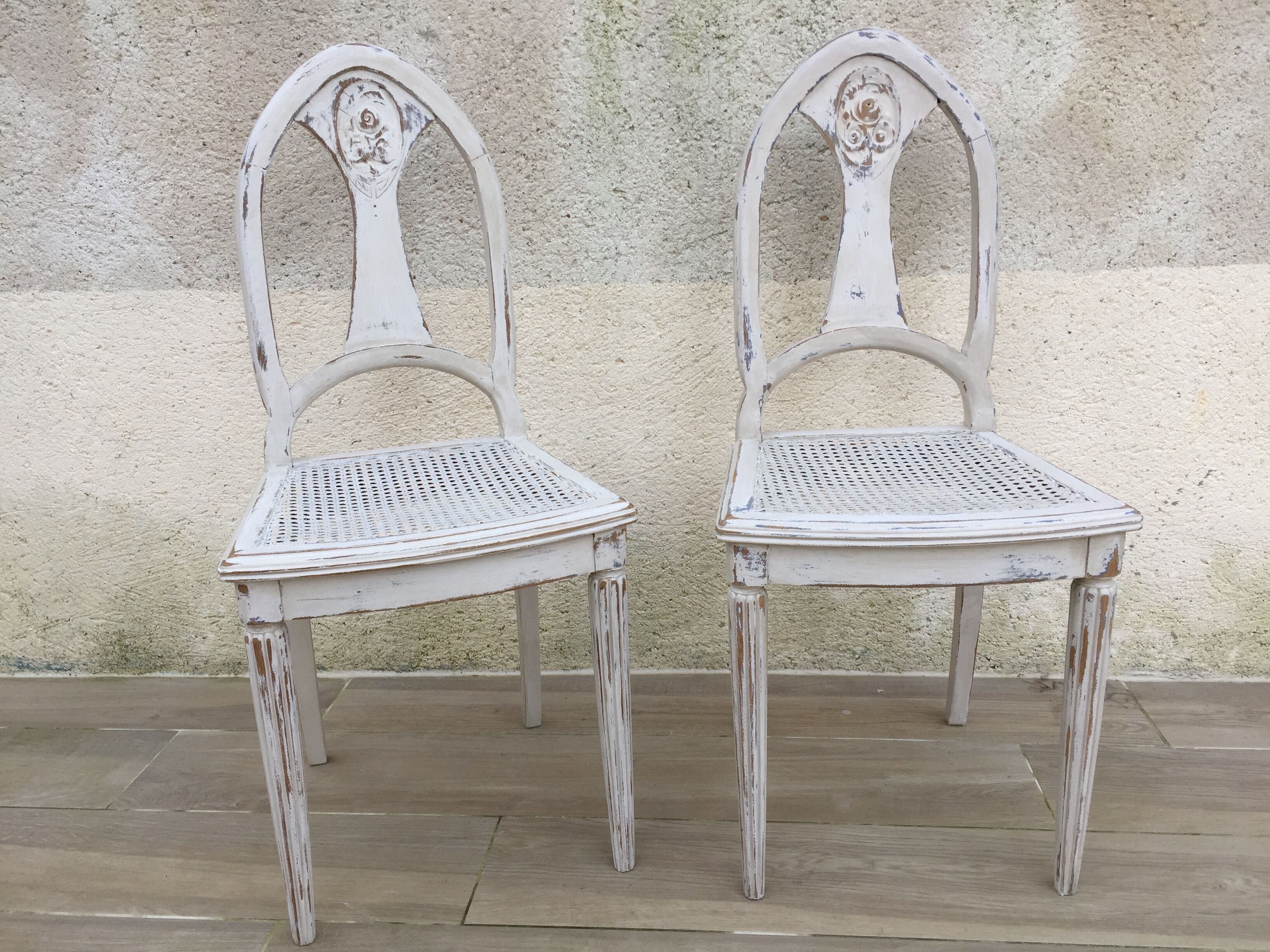 Pair of old white canne chairs