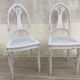 Pair of old white canne chairs