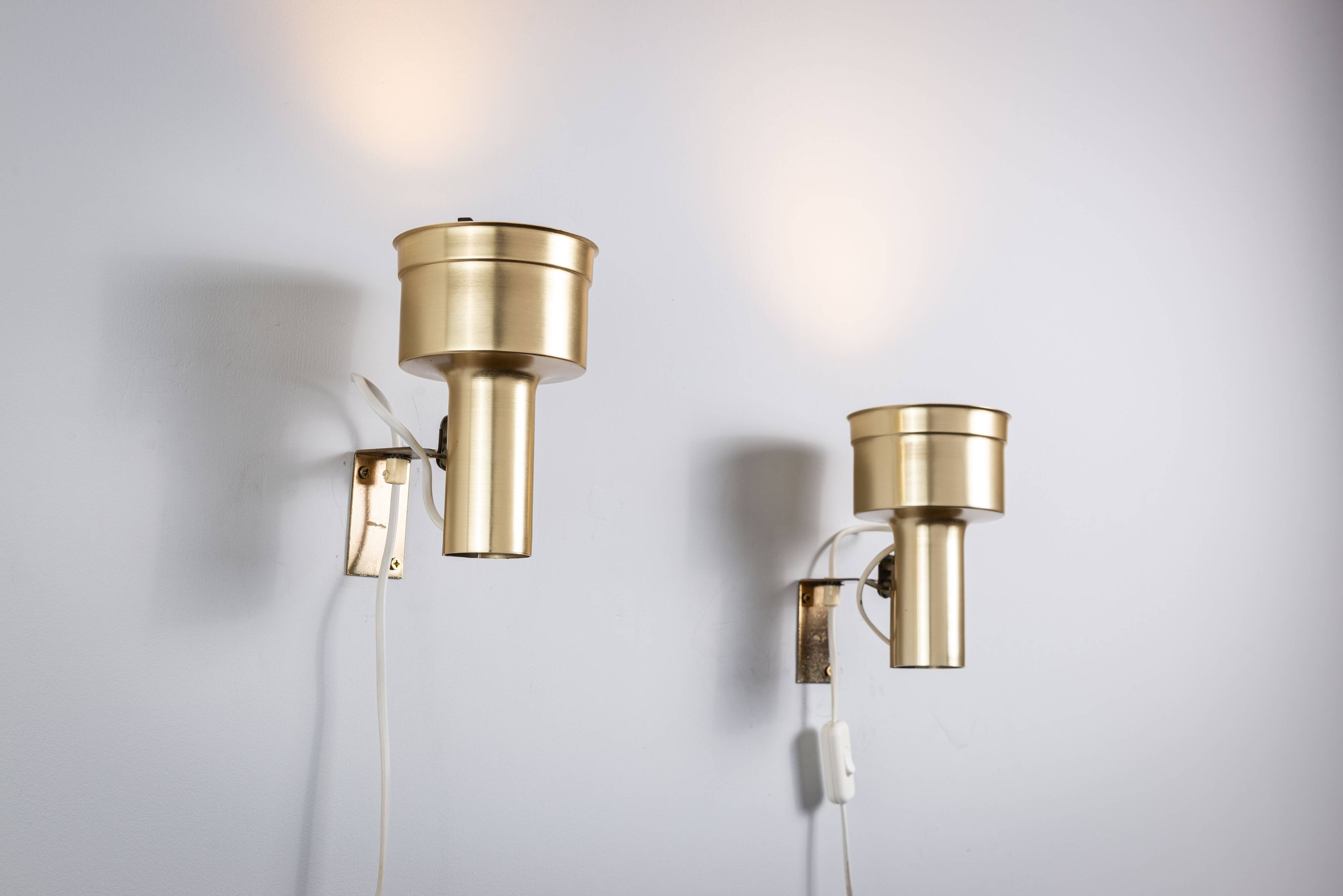 Pair of adjustable wall lamps designed by Per Sundstedt for Kosta Lampan