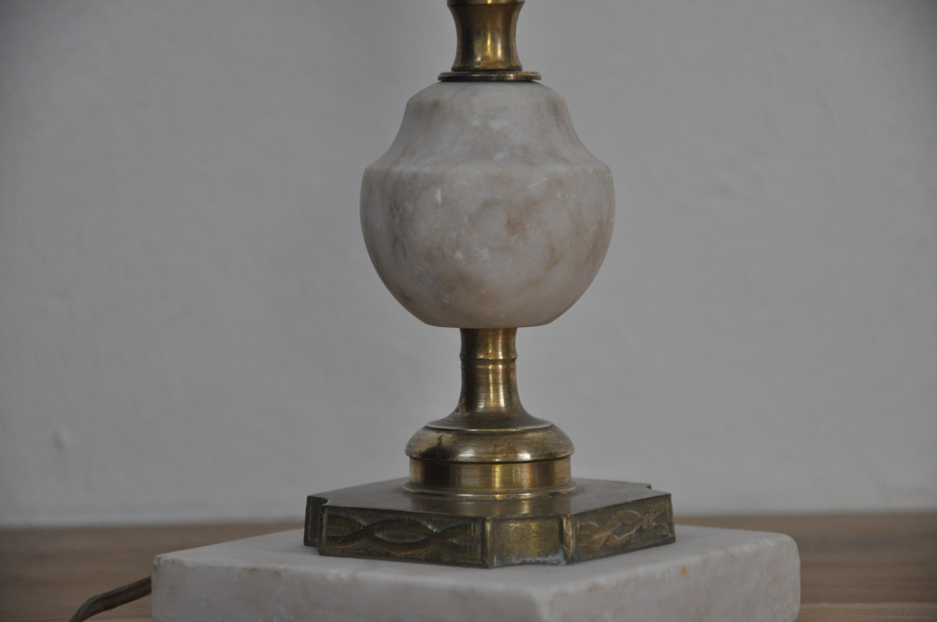 Ancient alabaster lamp and bronze cherub decoration