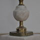 Ancient alabaster lamp and bronze cherub decoration