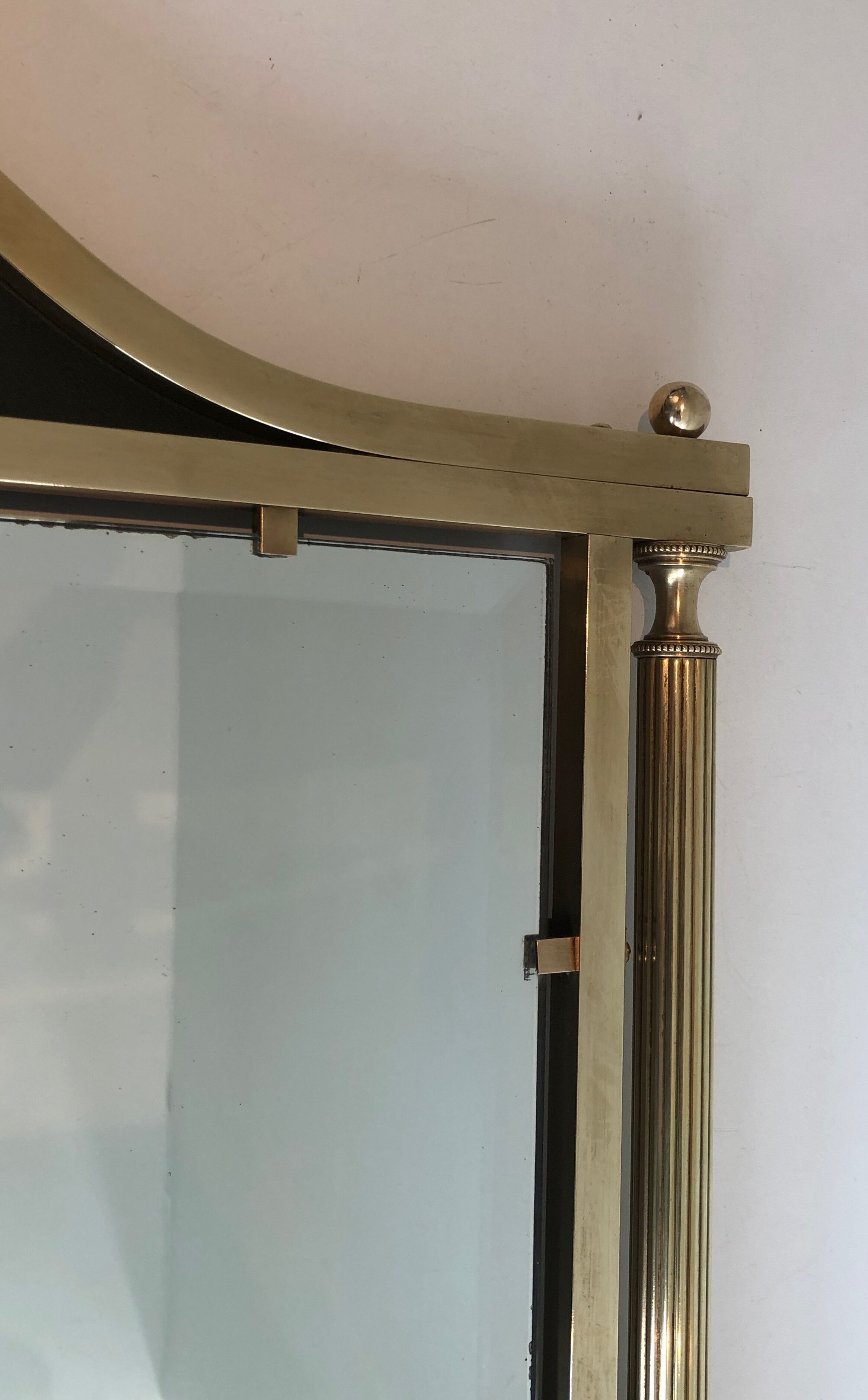 Neoclassical style mirror in brass and lacquered sheet metal