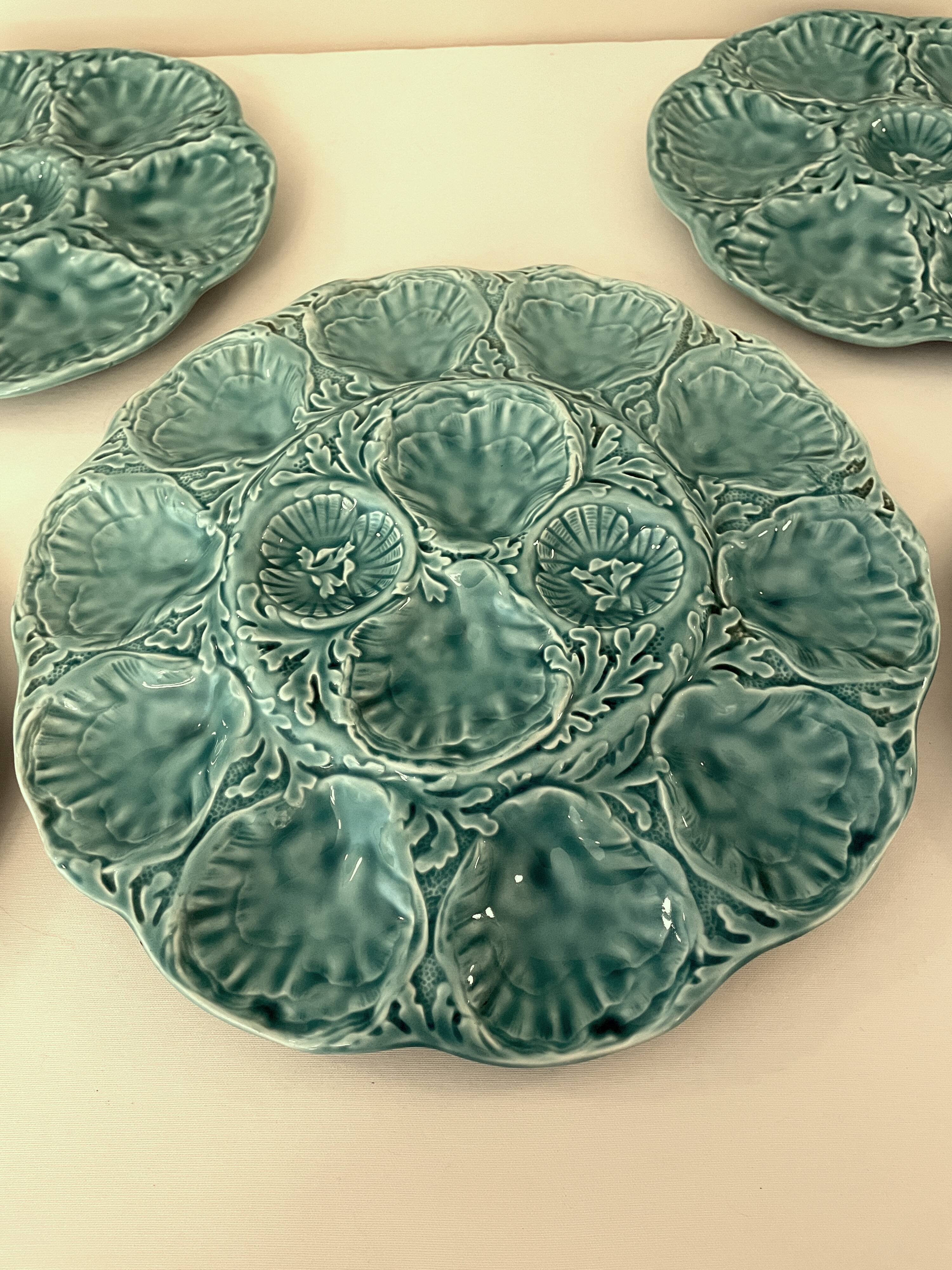 Dish and 4 turquoise faience oyster plates from Gien, France.
