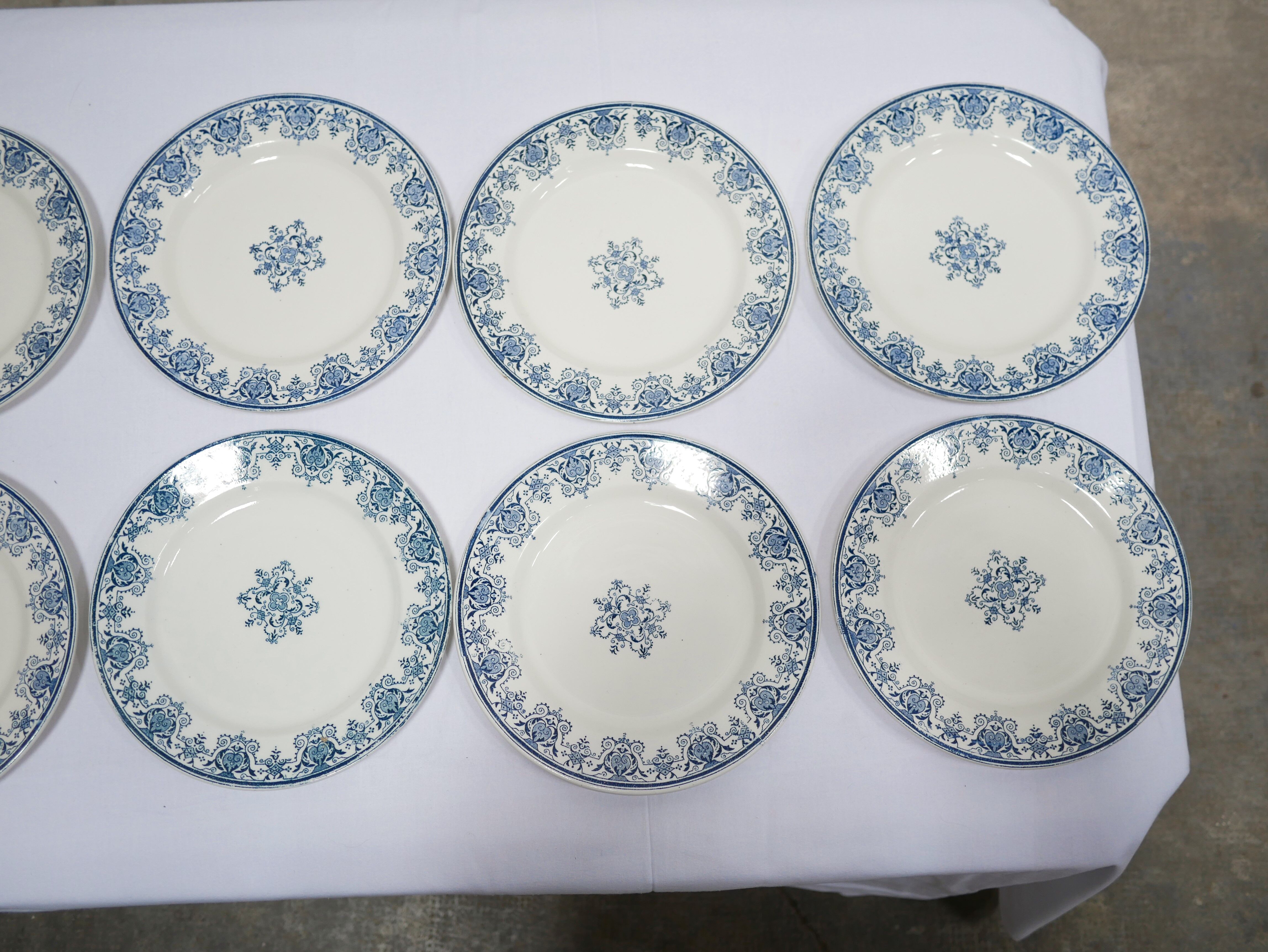 Series of 10 old Terre de Fer plates by L.G. for the earthenware factory of Clairefontaine