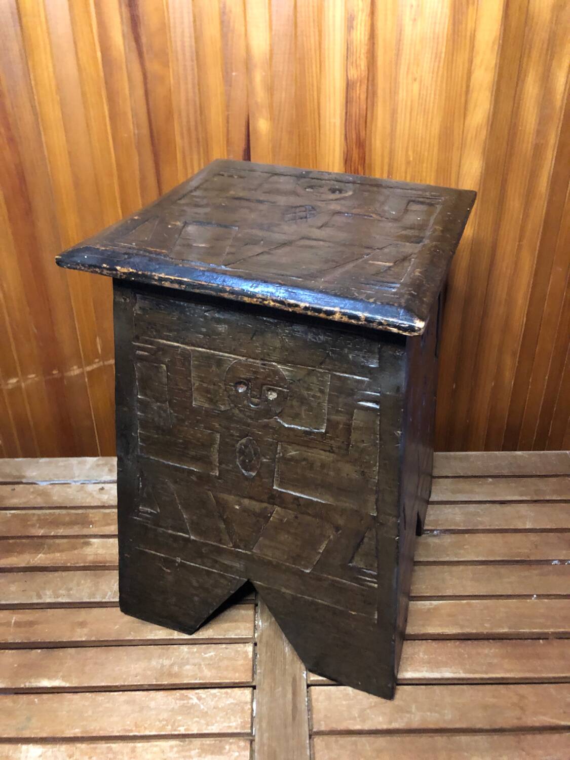 Old stool with vintage carved wood chest