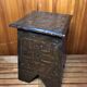 Old stool with vintage carved wood chest