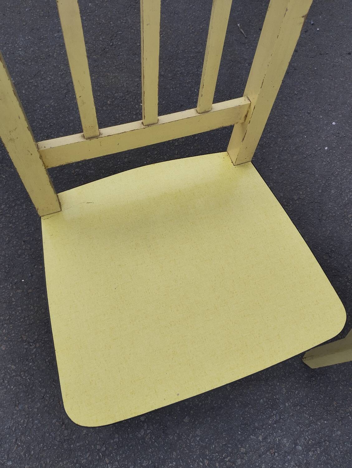 Pair of wooden and yellow formica chairs