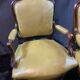Paire de larges fauteuils XIXe en cuir vert de style Louis XV