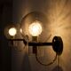 Wall lights with blown glass globes.