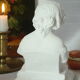 Limestone bust young girl who reads