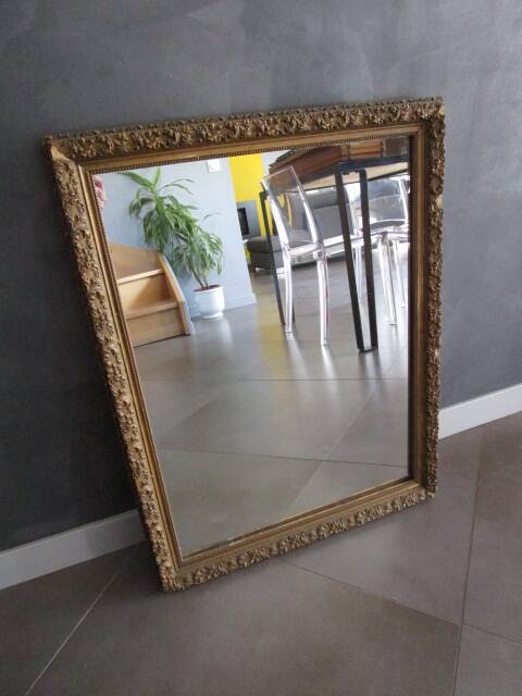 Antique mirror in wood and gilded stucco