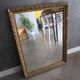 Antique mirror in wood and gilded stucco