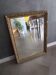 Antique mirror in wood and gilded stucco