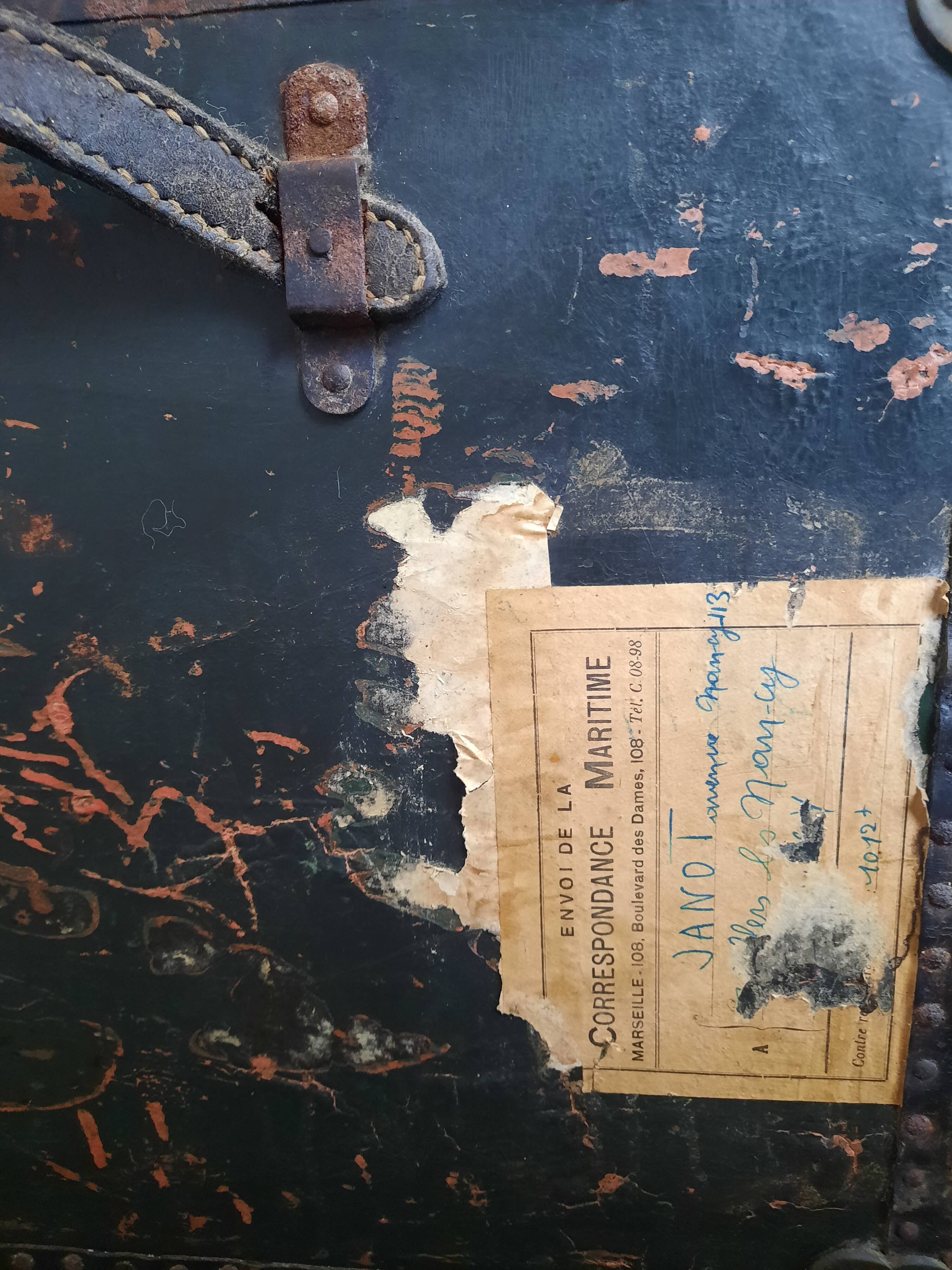 Old and large travel trunk, brass-plated corners