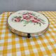Turntable with earthenware pastry and bakelite floral decoration