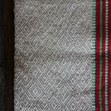 Old chevron towel with red and green stripes.