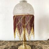 Lampe en laiton et perles, style charleston