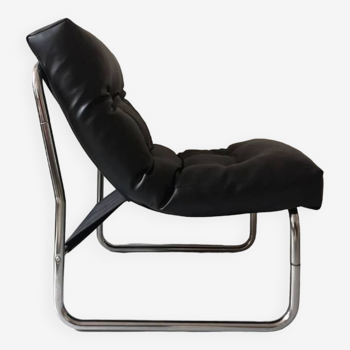 Tubular fireside chair in black skai and metal, design 1970