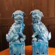 Pair of Foo dog bookends in turquoise glazed ceramic, Manises