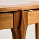 Coffee table in walnut with a ceramic top.