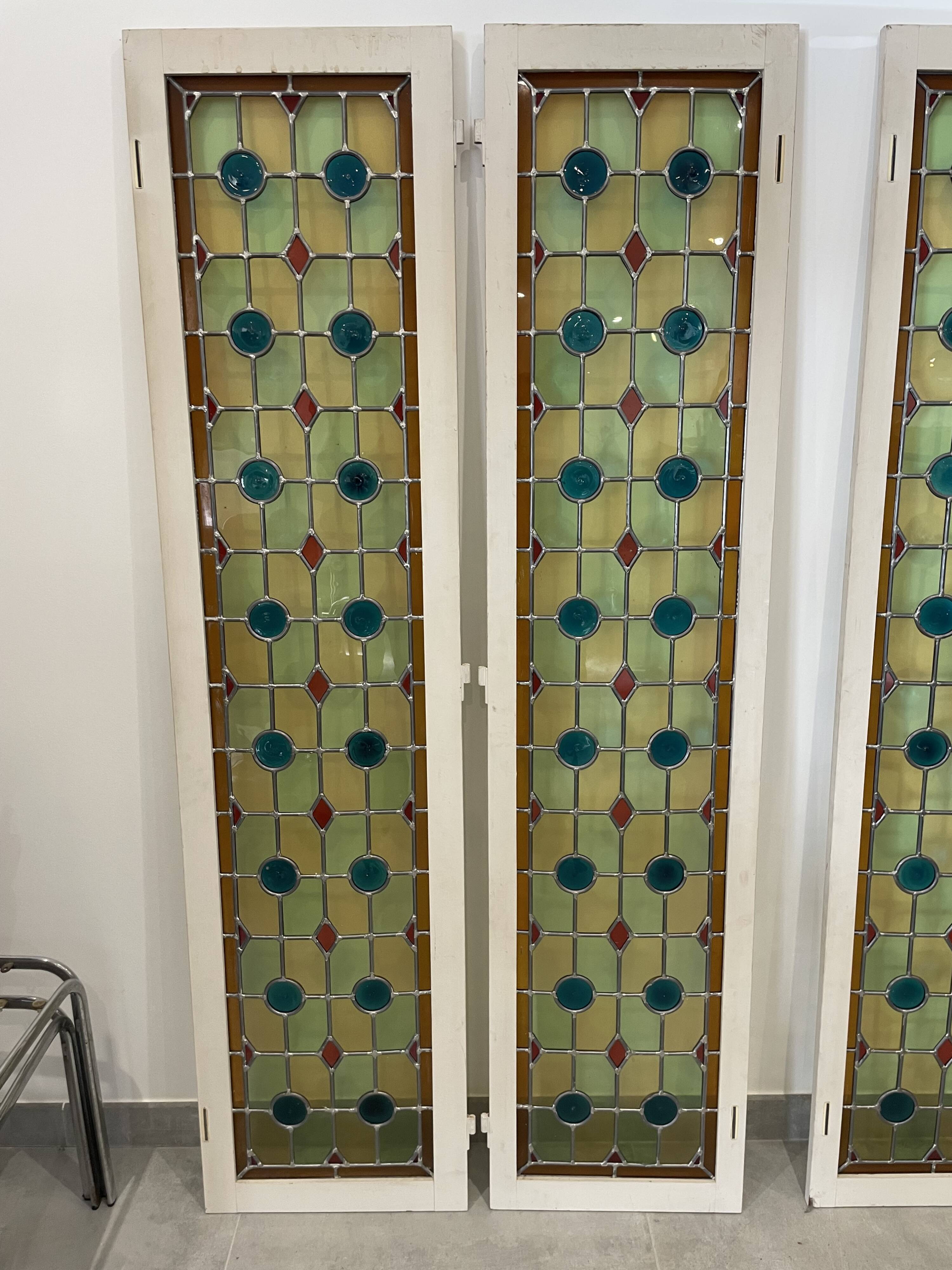 4 vintage faux stained glass panels that can form a screen or a partition