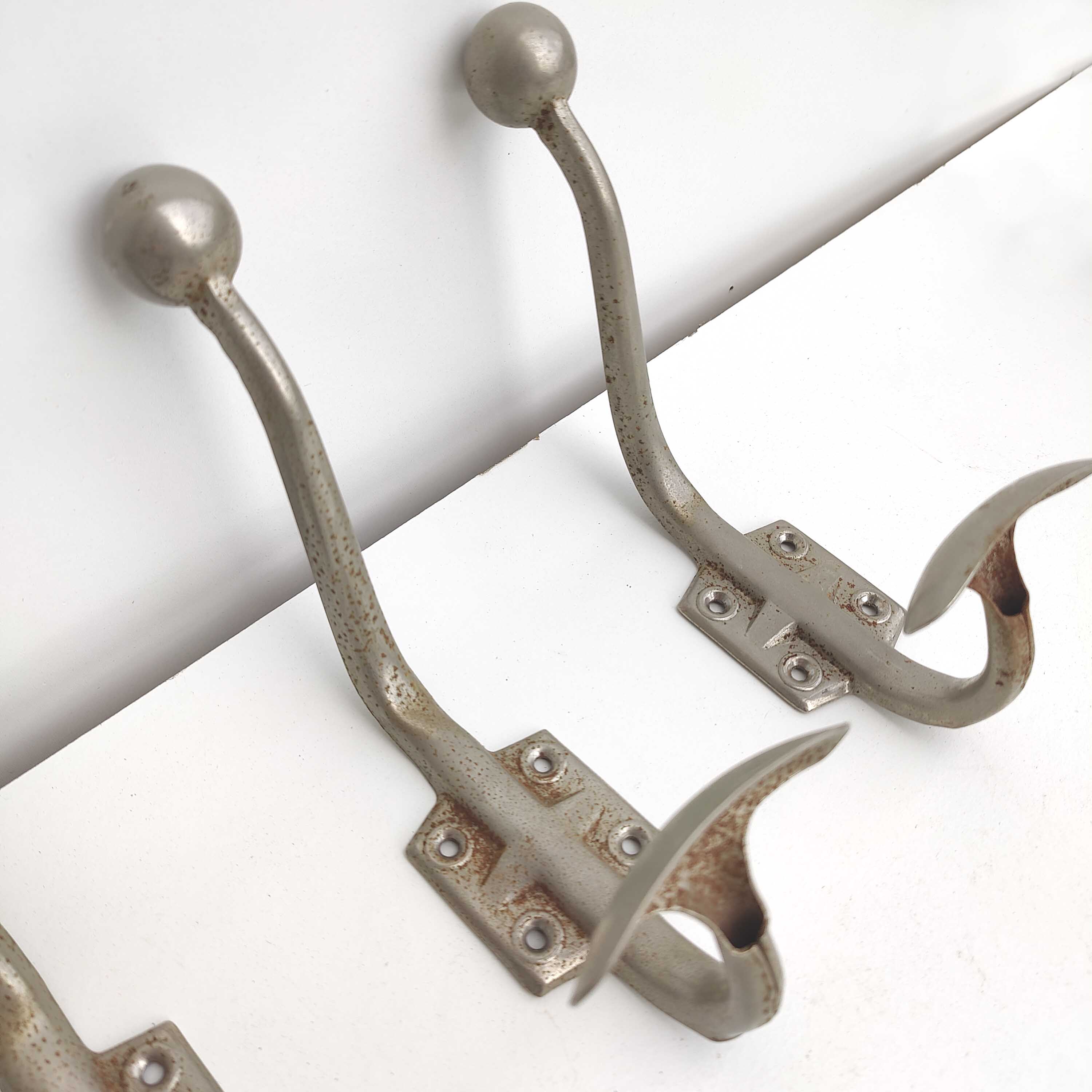Three metal hooks