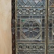 Jacobean hardwood library with carved panels and glass doors.