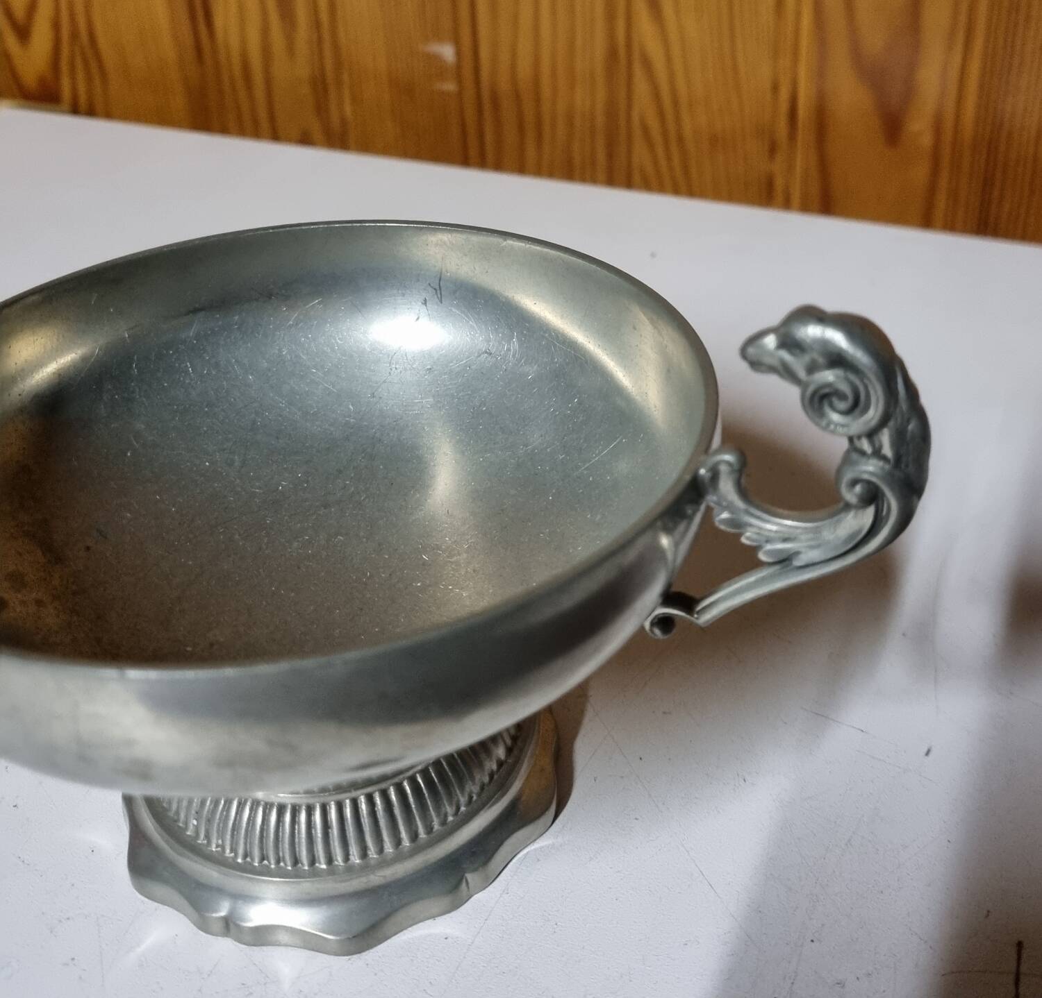 Burgundy footed cup in pewter with ram's head