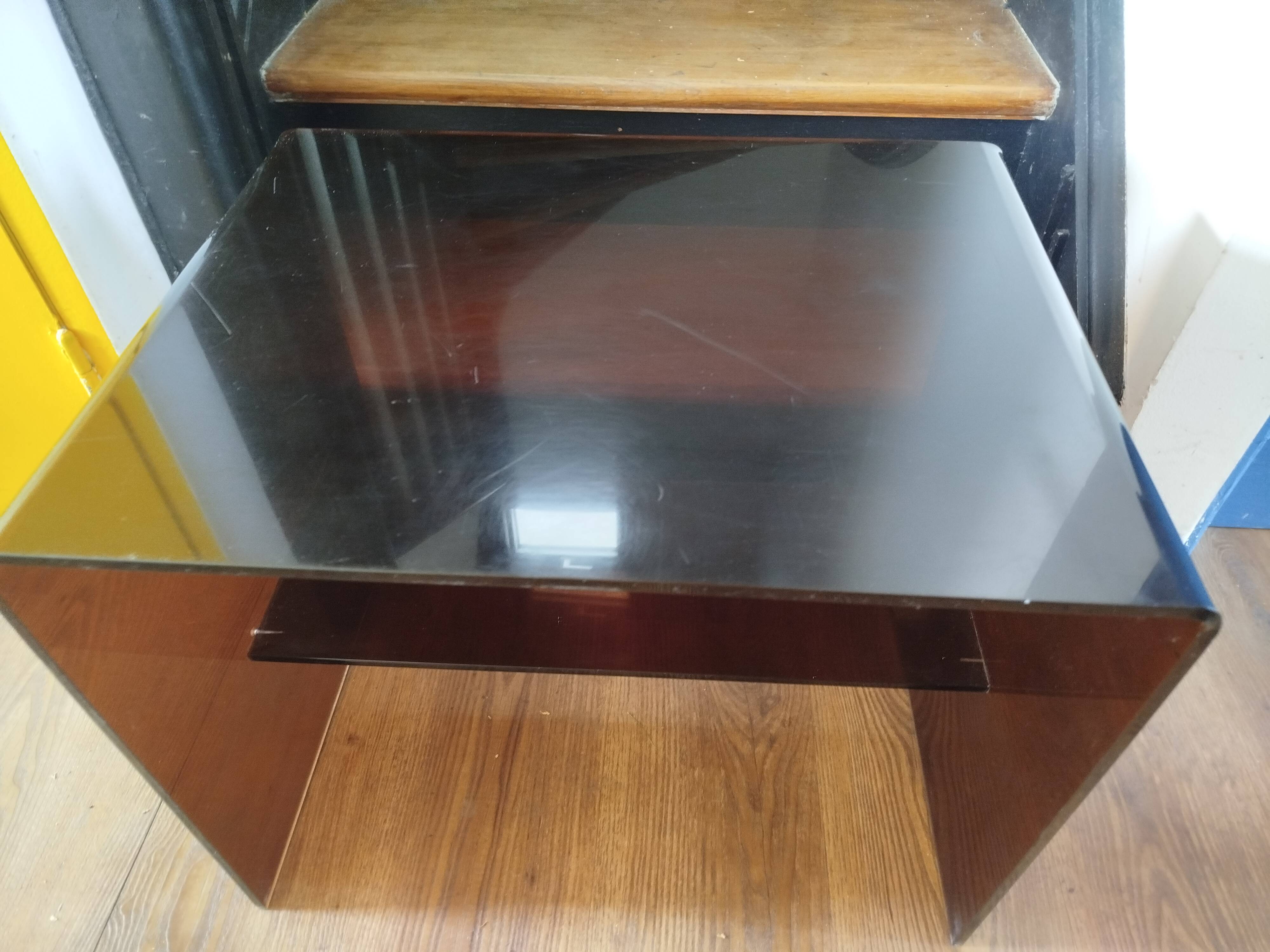 Coffee table / accent piece by Michel Dumas in smoked plexiglass – year