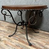 Hammered iron coffee table with circular wooden top