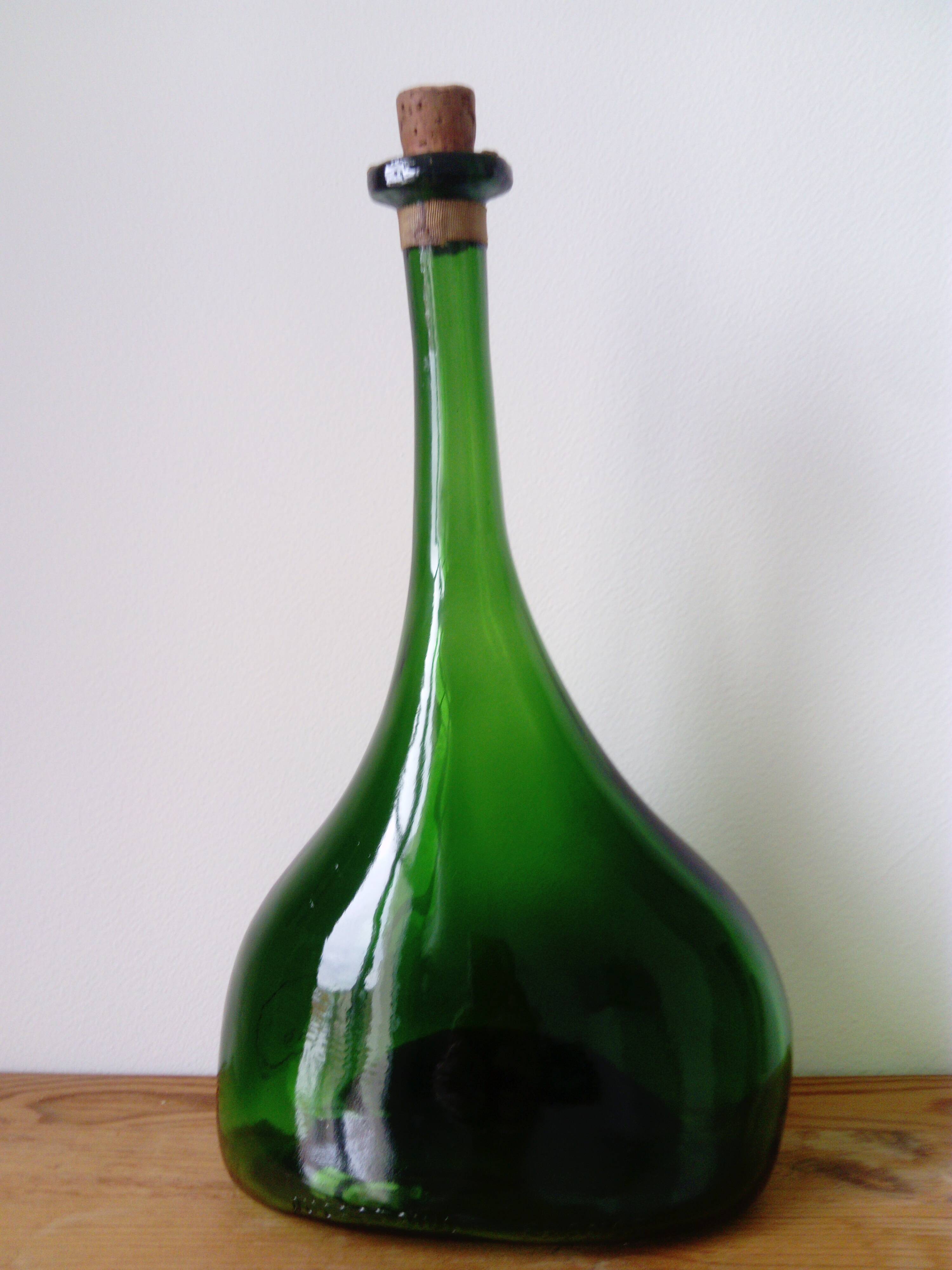 Old blown glass bottle, free form. Armagnac