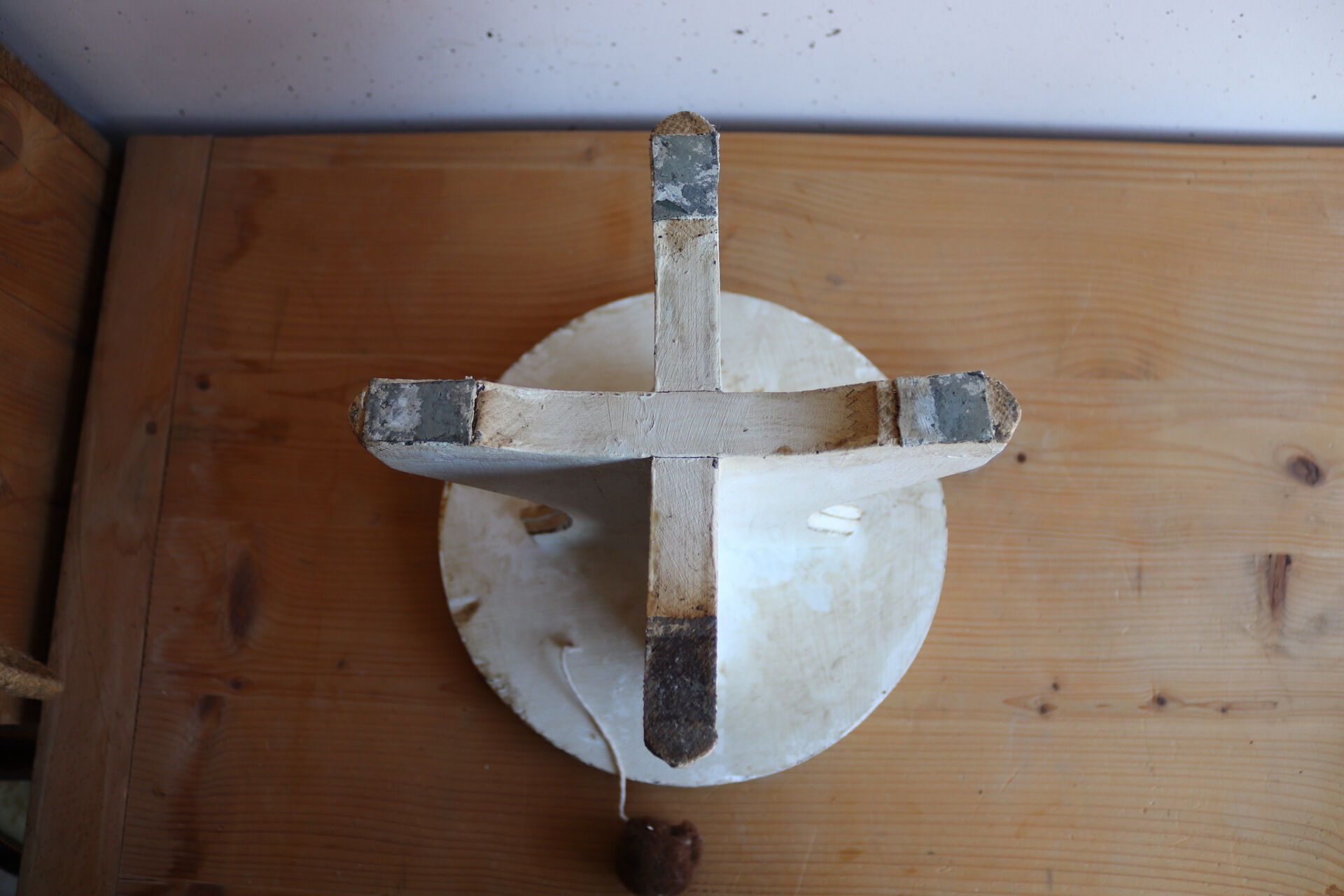 Small wooden stool painted with a star design.