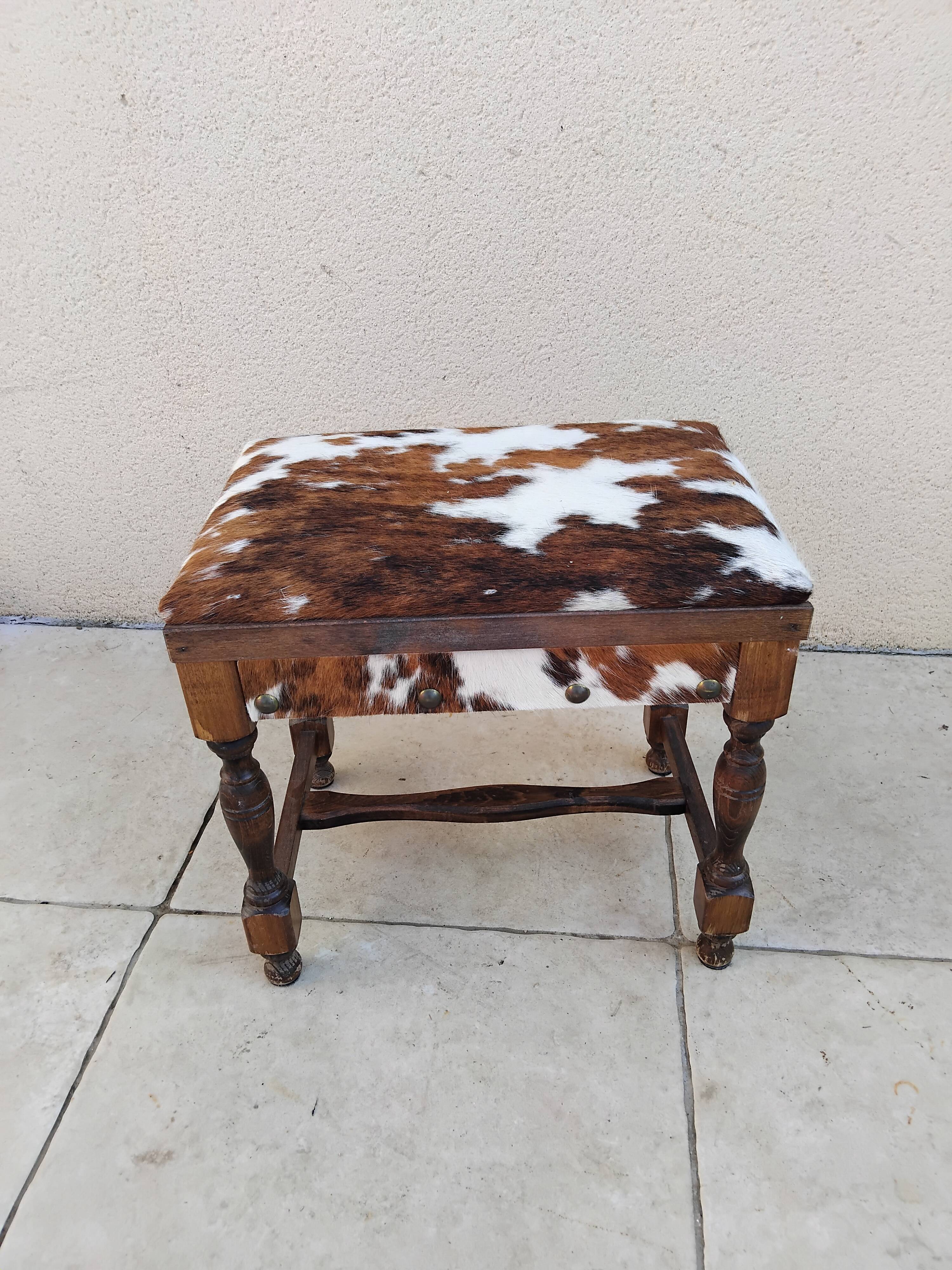 Vintage cowhide trunk stool