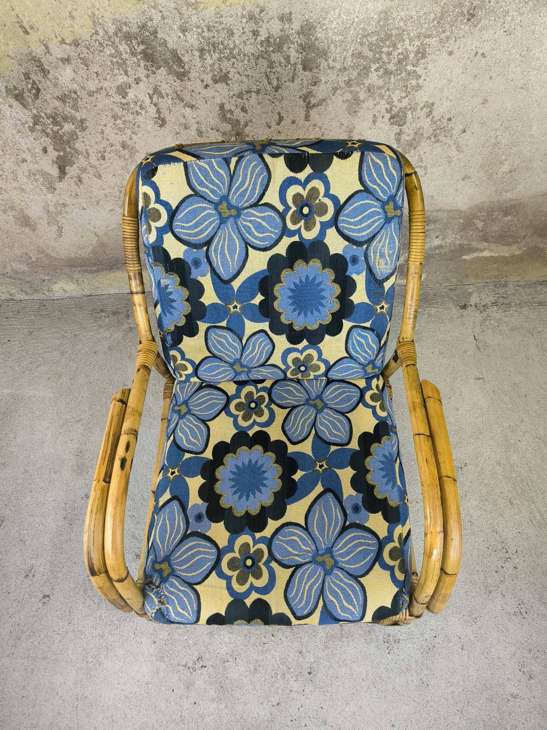 Vintage armchair in rattan and floral fabric