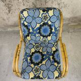 Vintage armchair in rattan and floral fabric