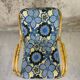 Fauteuil vintage en rotin et tissu à fleurs
