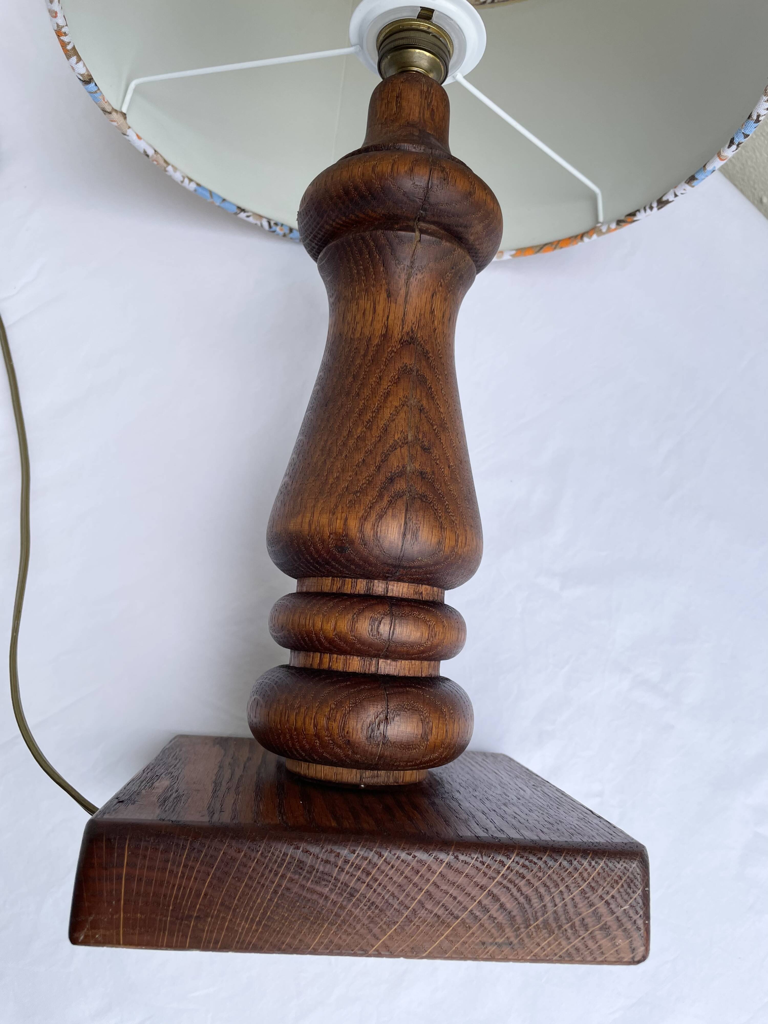 Vintage turned wood table lamp with floral drum shade.