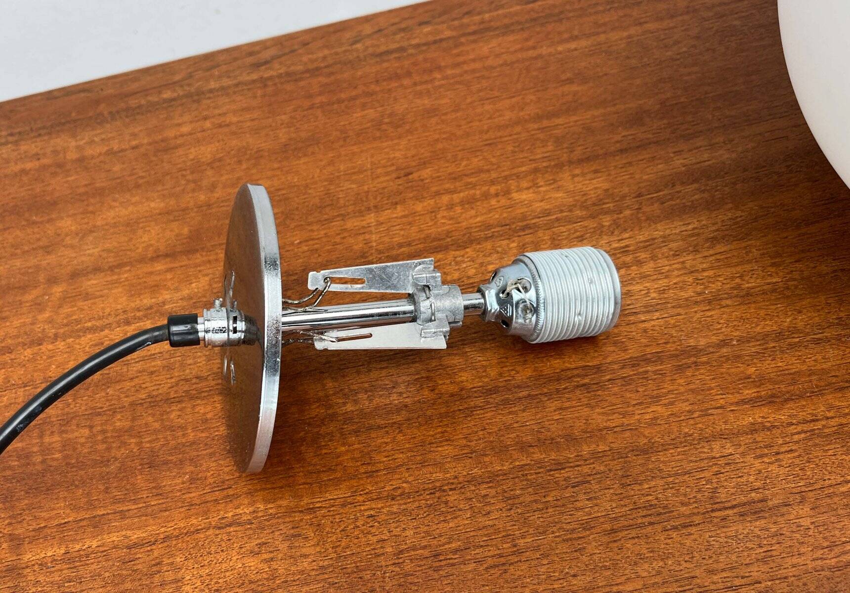 Minimalist suspended glass ball lamp from the vintage German space age by Glashütte Limburg, 1970s.