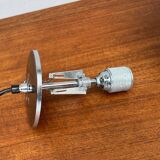 Minimalist suspended glass ball lamp from the vintage German space age by Glashütte Limburg, 1970s.