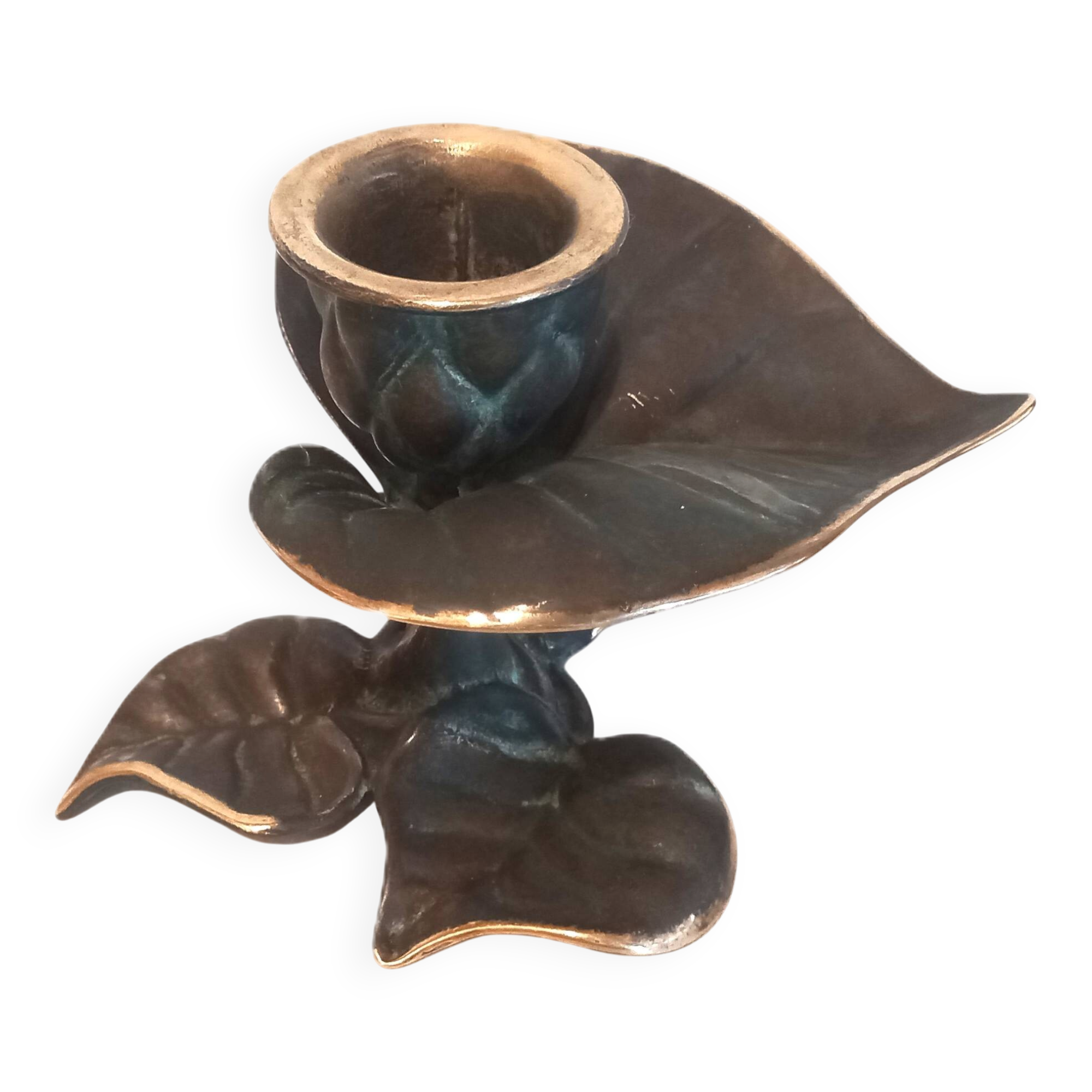 Patinated green brass candlestick with foliage decoration.