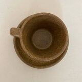 Set of stoneware coffee cups with saucers