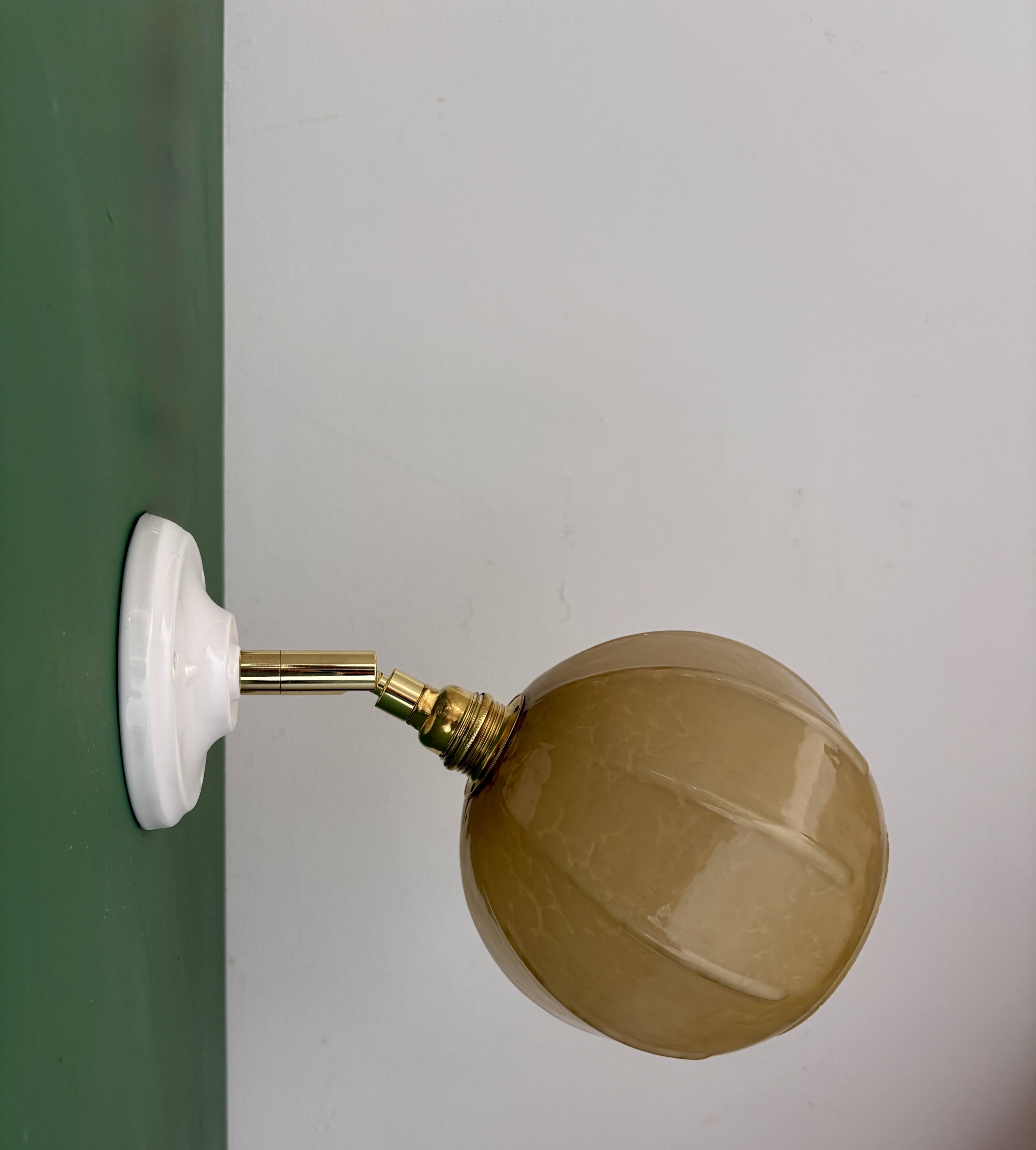 Vintage yellow glass globe wall light