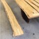 Chestnut and walnut solid table and benches with a central leg.