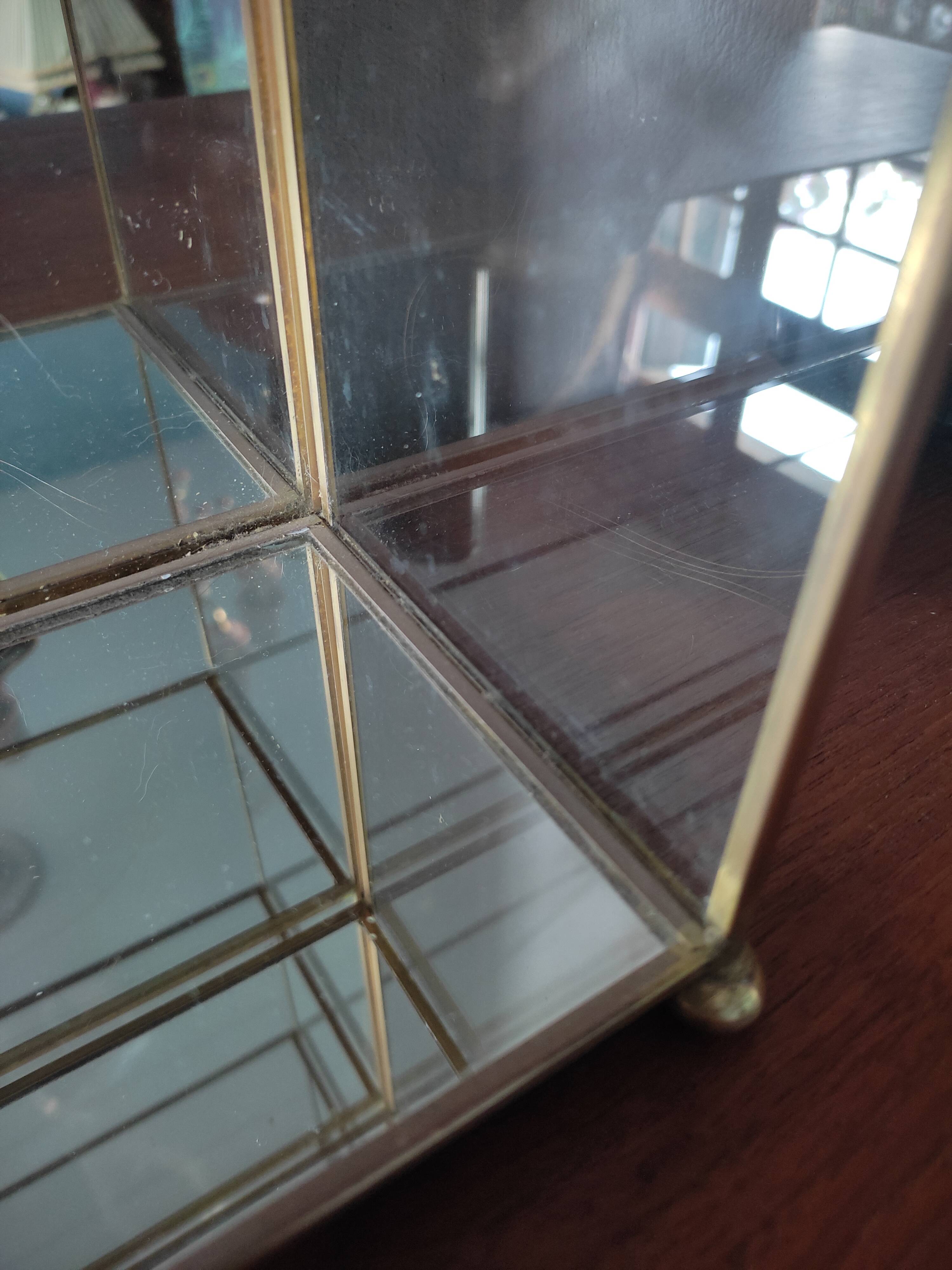 Glazed brass shelf to install