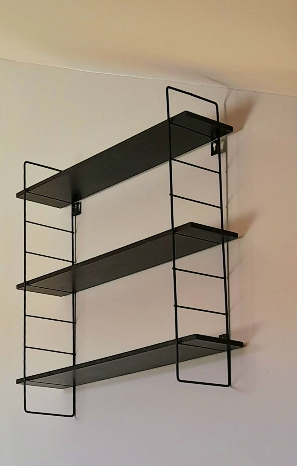 String style wall shelf
