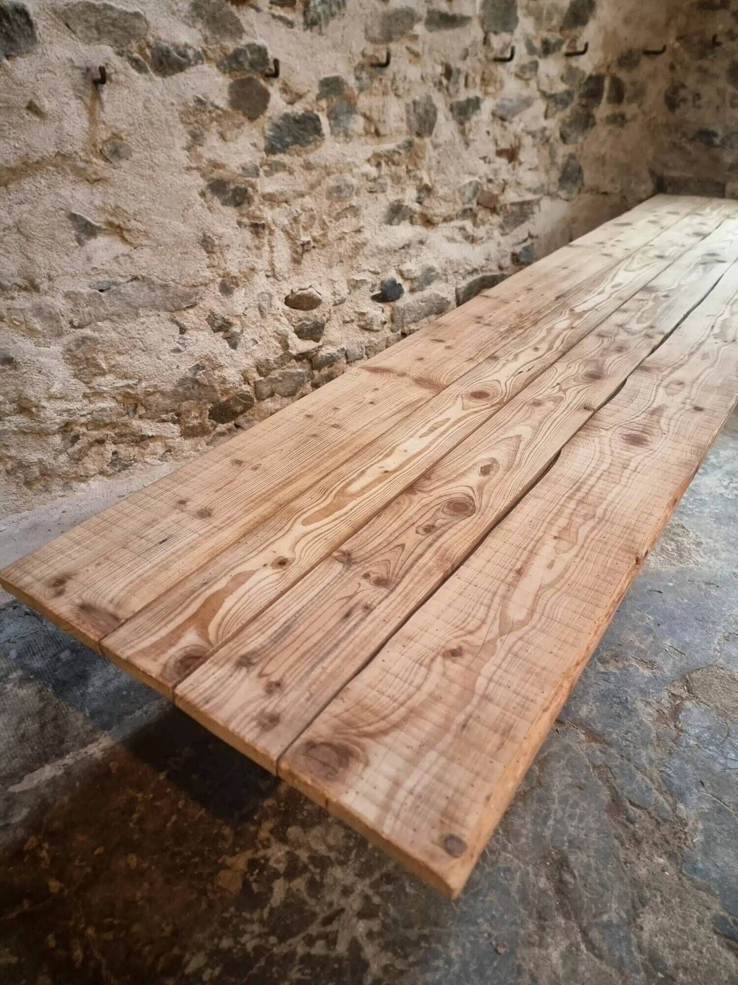 Old French industrial table with a cast iron base and a pine top.