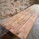 Old French industrial table with a cast iron base and a pine top.